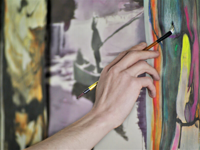 woman painting at a group art class